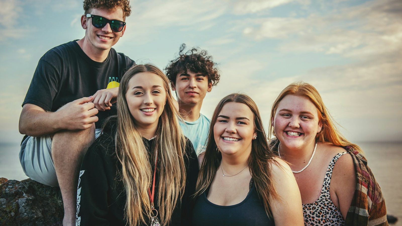 photography of five people near outdoor during daytime